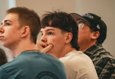 Teen listening to speaker